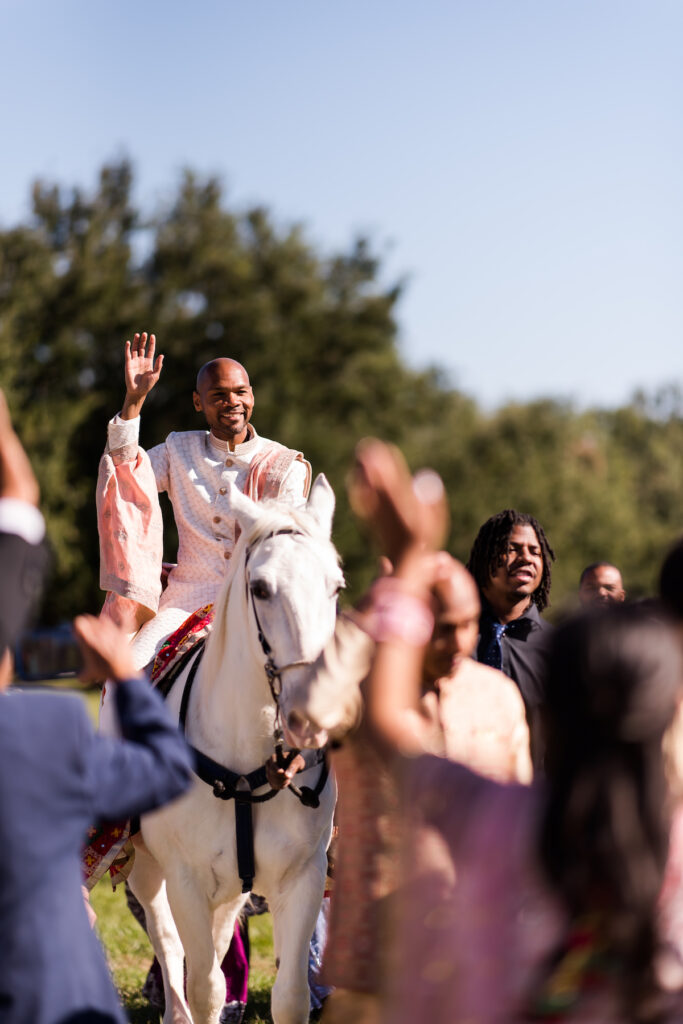 Indian nuptials features fuchsia florals, a sangeet pre-wedding party, and a stunning Hindu wedding ceremony at the New Orleans Museum of Art. 