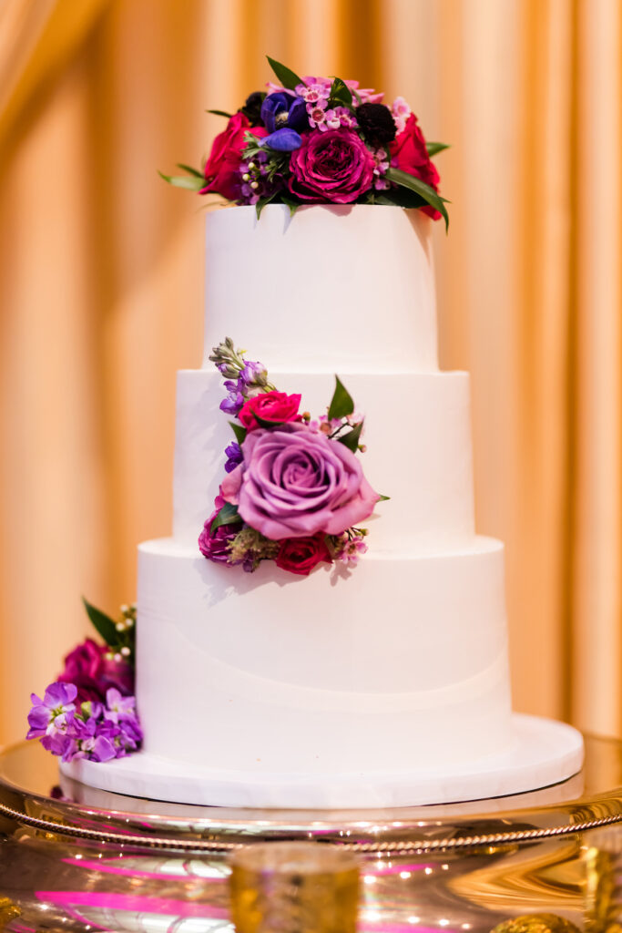 Indian nuptials features fuchsia florals, a sangeet pre-wedding party, and a stunning Hindu wedding ceremony at the New Orleans Museum of Art.