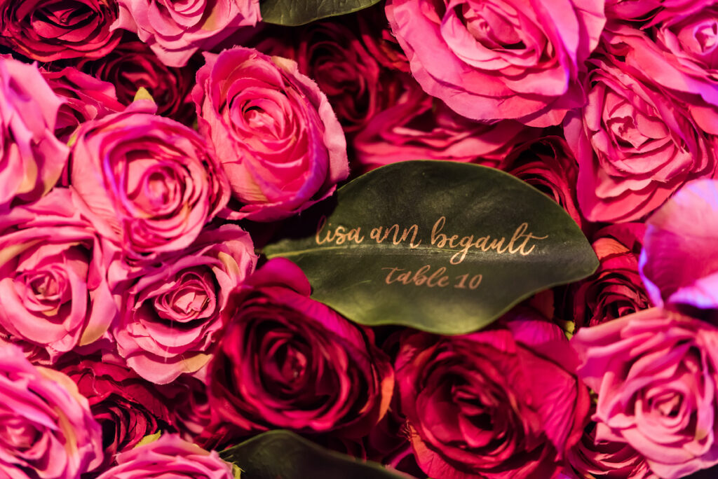 Indian nuptials features fuchsia florals, a sangeet pre-wedding party, and a stunning Hindu wedding ceremony at the New Orleans Museum of Art.