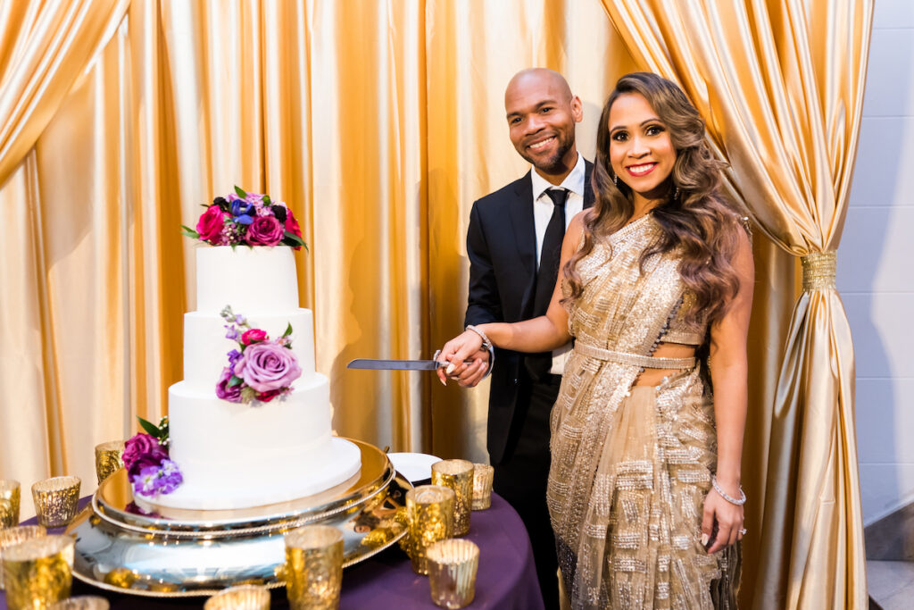 Indian nuptials features fuchsia florals, a sangeet pre-wedding party, and a stunning Hindu wedding ceremony at the New Orleans Museum of Art.