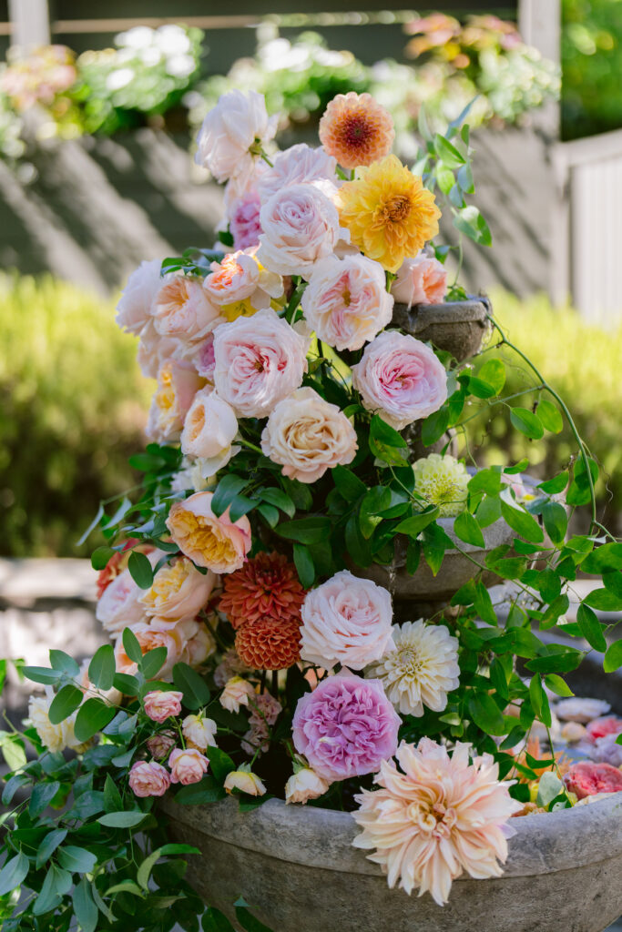 Bursting with colorful summer florals and sweet details, love blooms in this private estate wedding at the bride's grandmother's home in Walnut Creek, California.