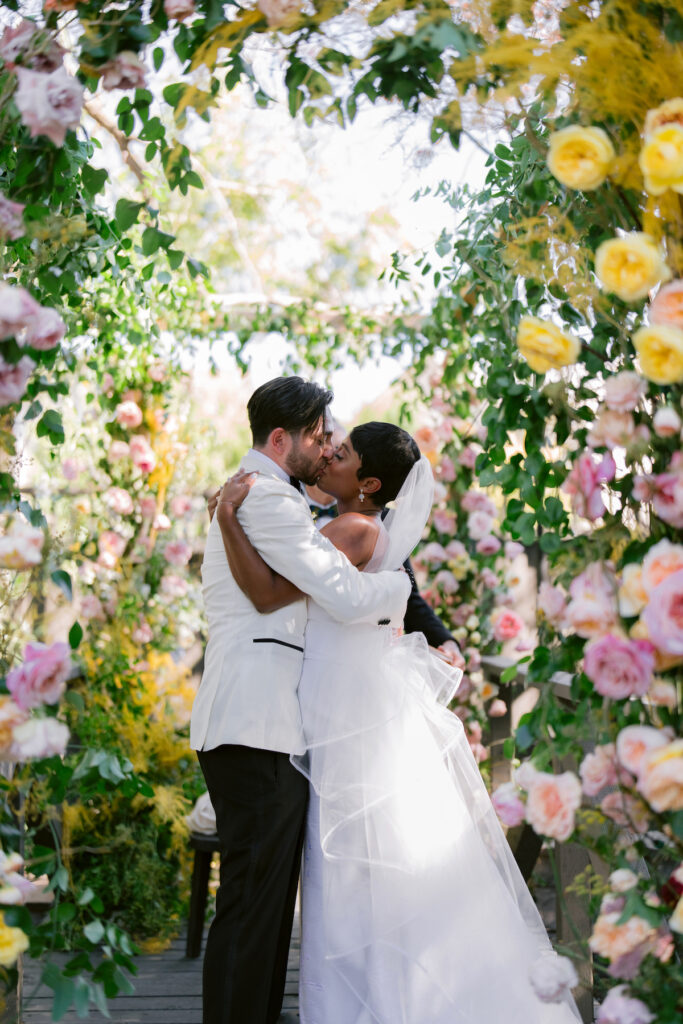 Bursting with colorful summer florals and sweet details, love blooms in this private estate wedding at the bride's grandmother's home in Walnut Creek, California.
