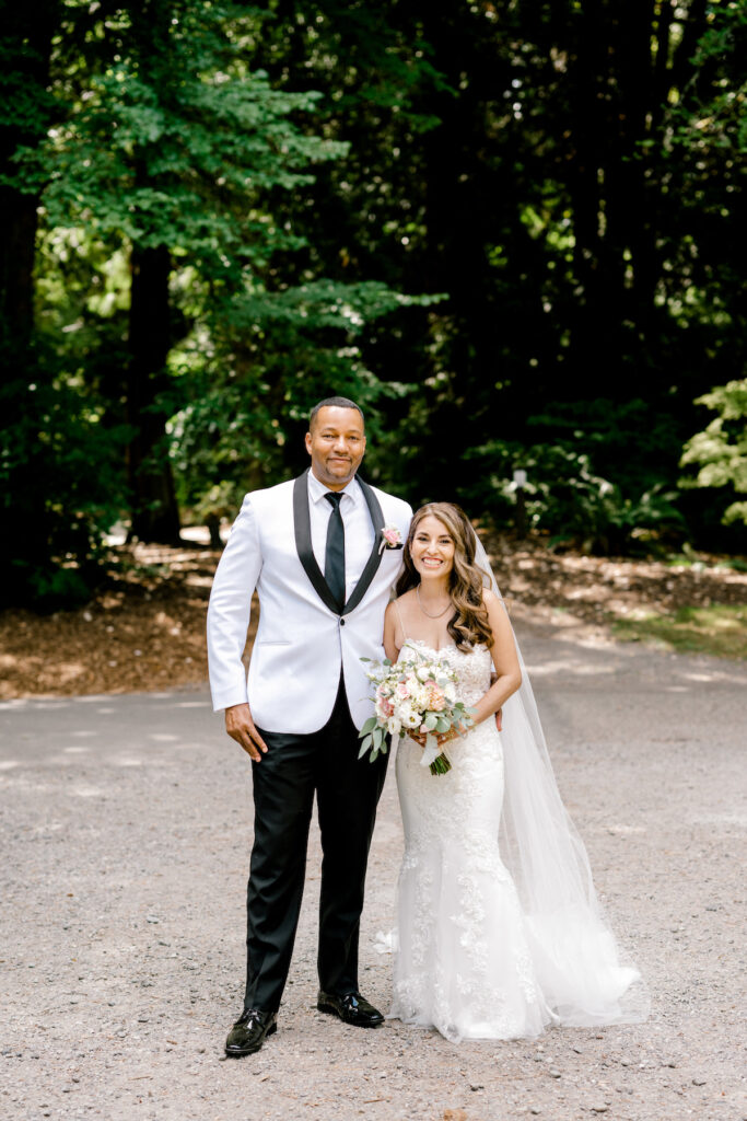 This waterfront wedding at the Tyee Yacht Club in Seattle, WA, features soft pink blooms, pops of red, and a bilingual English/Spanish ceremony.