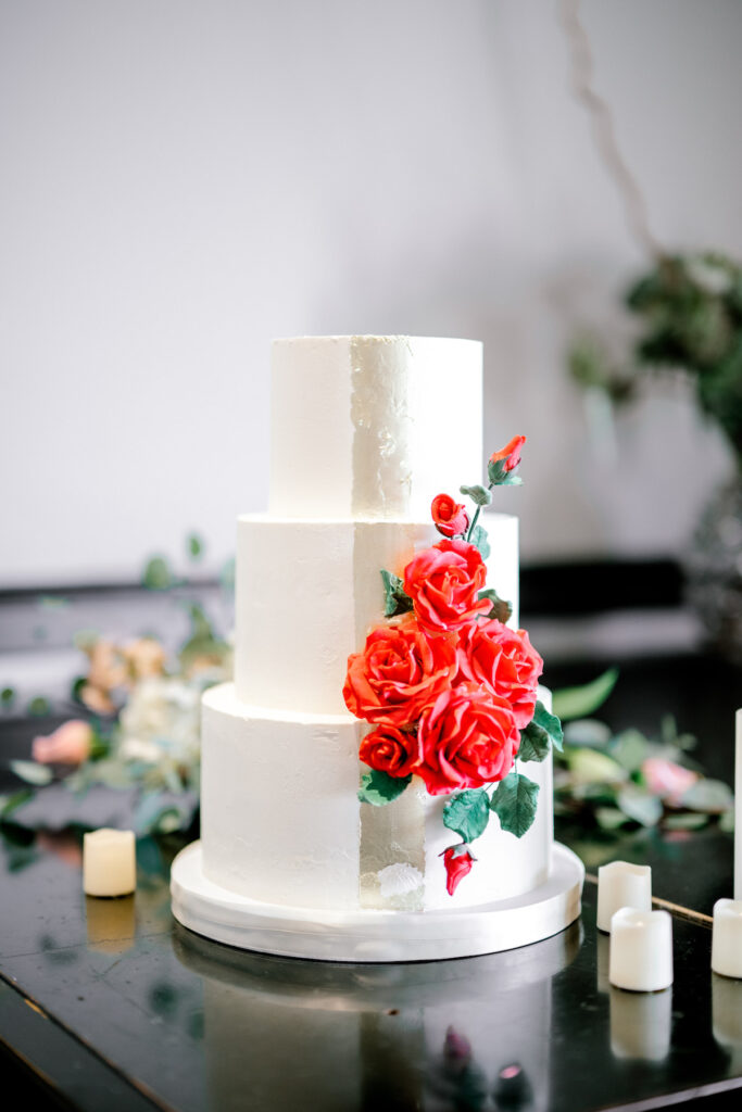 This waterfront wedding at the Tyee Yacht Club in Seattle, WA, features soft pink blooms, pops of red, and a bilingual English/Spanish ceremony.