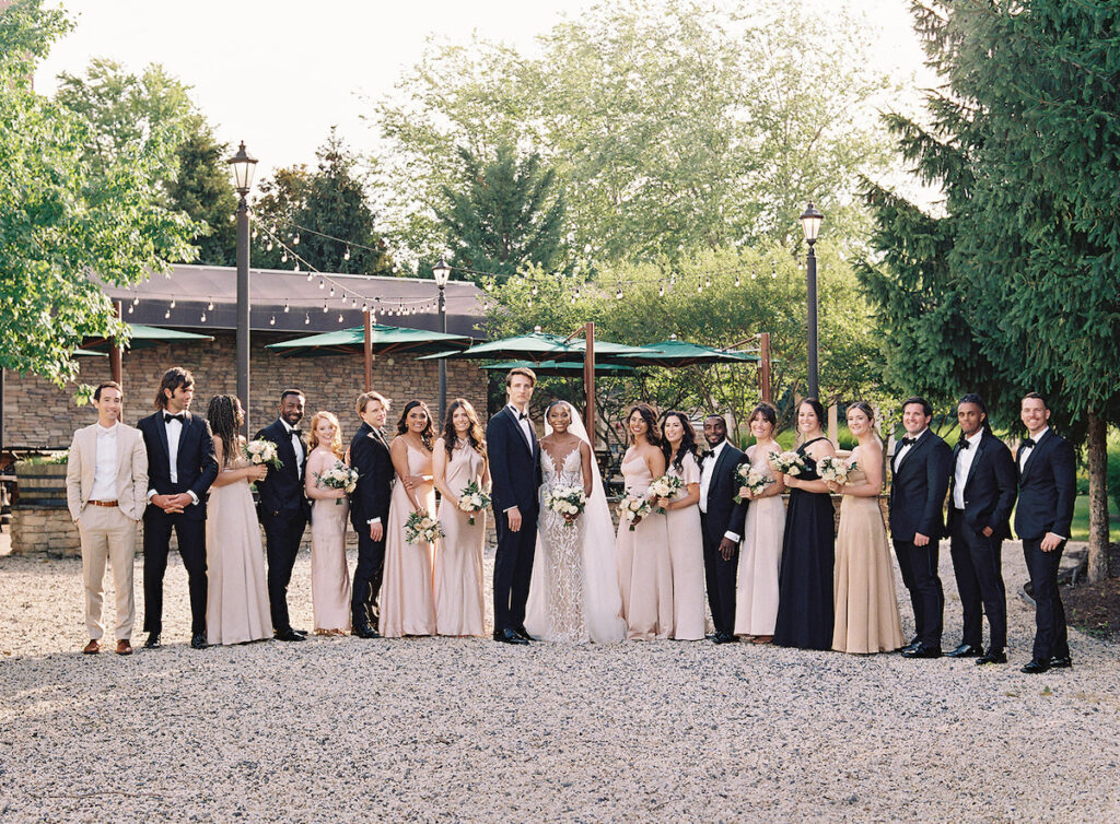 Attorneys say "I Do!" in a romantic outdoor ceremony at the Lansdowne Resort in Leesburg, VA. Featuring classy decor, gold details, and a gorgeous custom gown by Berta Bridal. 