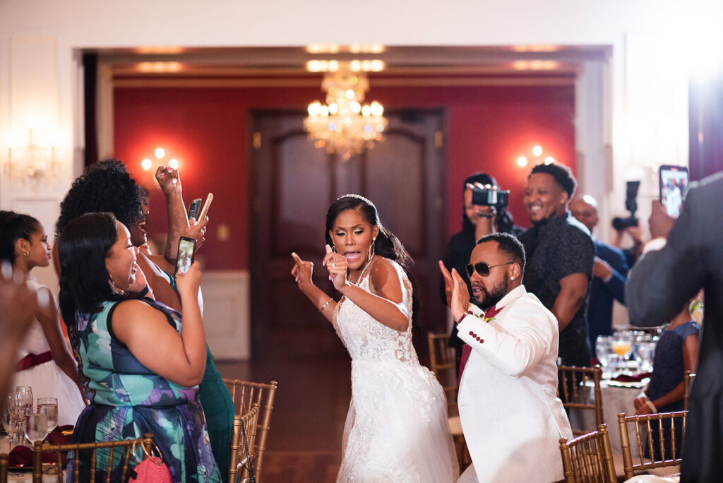 The Datcher's timeless wedding at Rose Hill Manor in Leesburg, Virginia, exudes the utmost sophistication with an emotional first touch, a rich burgundy and ivory color palette, and a lively reception.