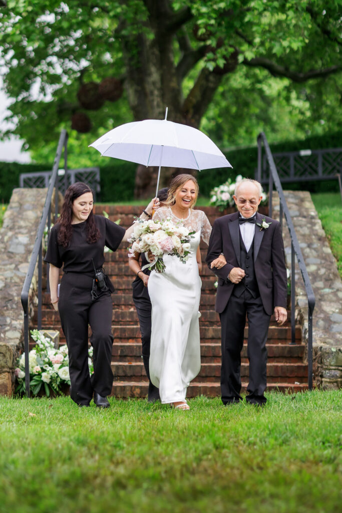 Wedding day showers couldn't put a damper on Merriam and Garry's outdoor wedding in Virginia held at Montalto overlooking Monticello.