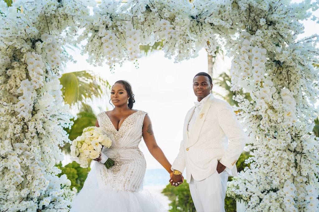 Beautiful brides say “I Do!” in a traditional and elegant destination wedding at the Finest Playa Mujeres in Mexico with lux florals & decor!