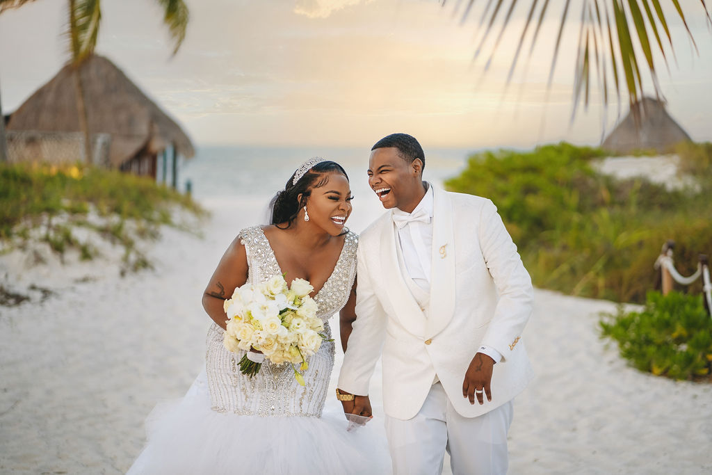 Beautiful brides say “I Do!” in a traditional and elegant destination wedding at the Finest Playa Mujeres in Mexico with lux florals & decor!