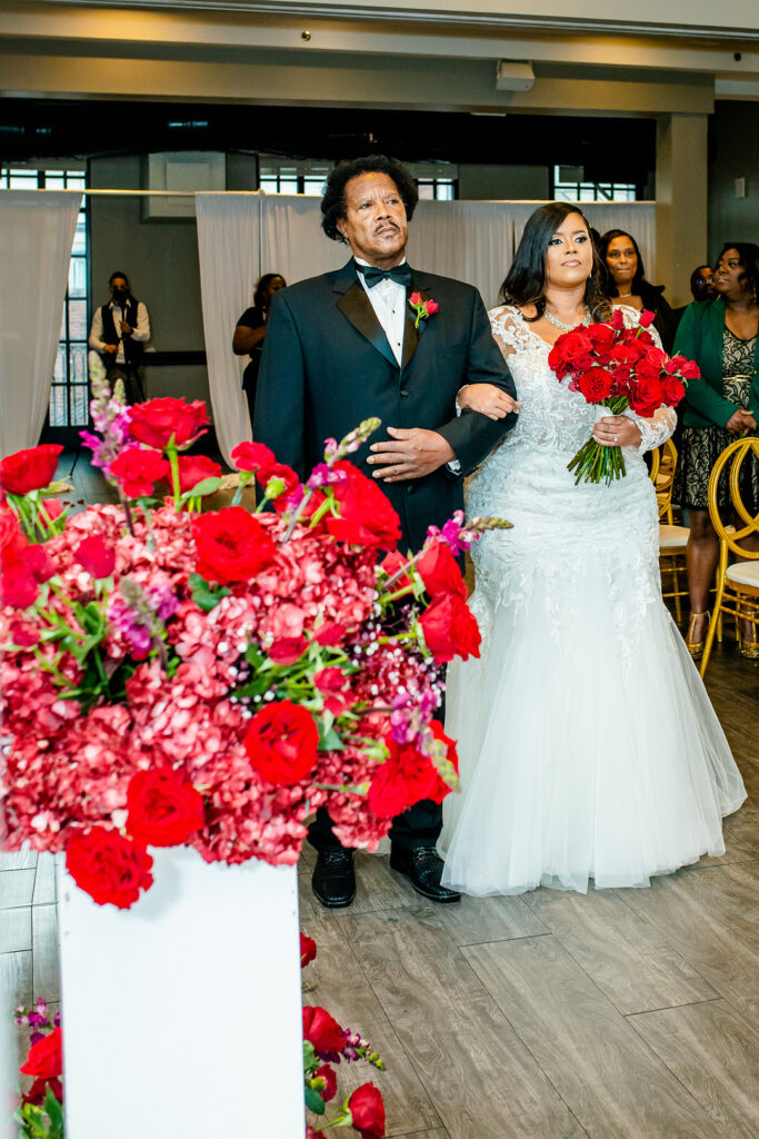 Jeremiah and Candace's luxe ballroom wedding in South Carolina featured oh-so-pretty red florals with an elegantly chic style.