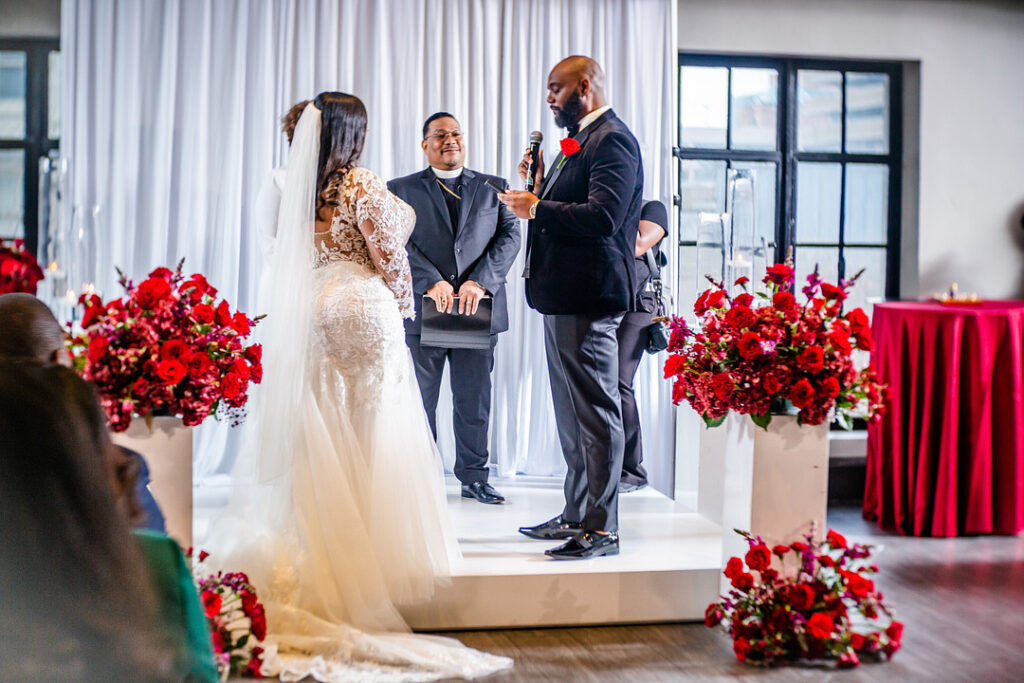 Jeremiah and Candace's luxe ballroom wedding in South Carolina featured oh-so-pretty red florals with an elegantly chic style.