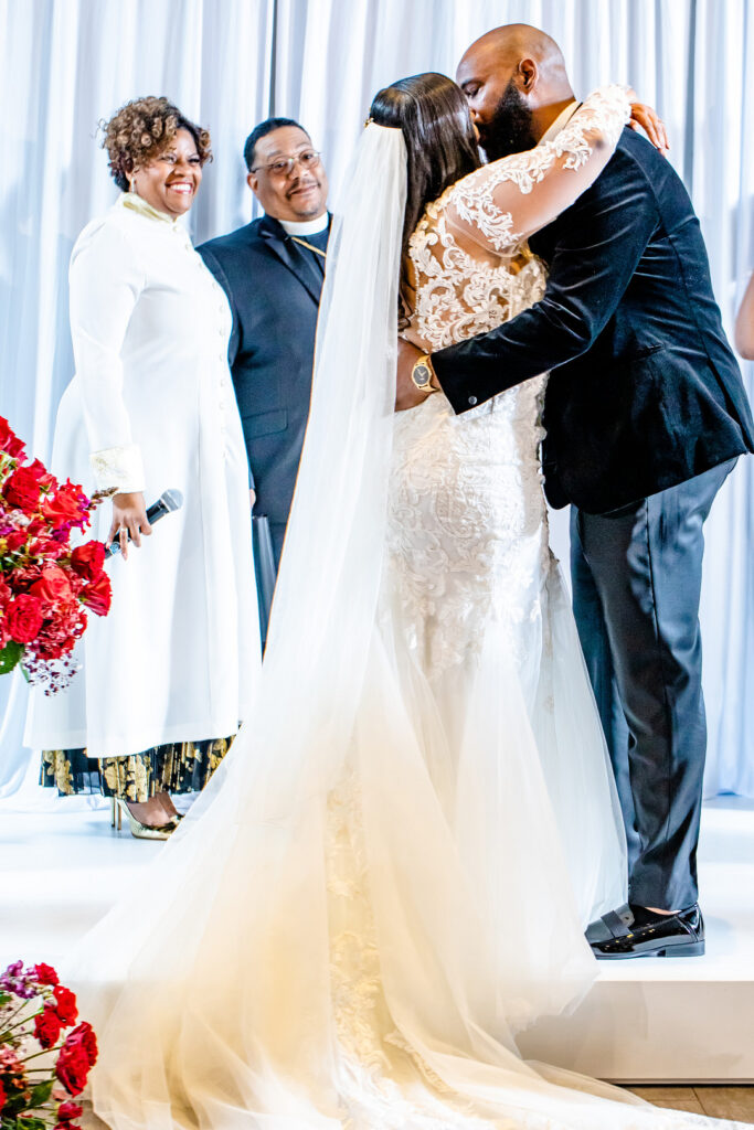 Jeremiah and Candace's luxe ballroom wedding in South Carolina featured oh-so-pretty red florals with an elegantly chic style.