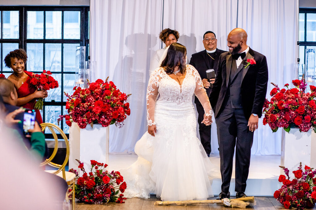 Jeremiah and Candace's luxe ballroom wedding in South Carolina featured oh-so-pretty red florals with an elegantly chic style.