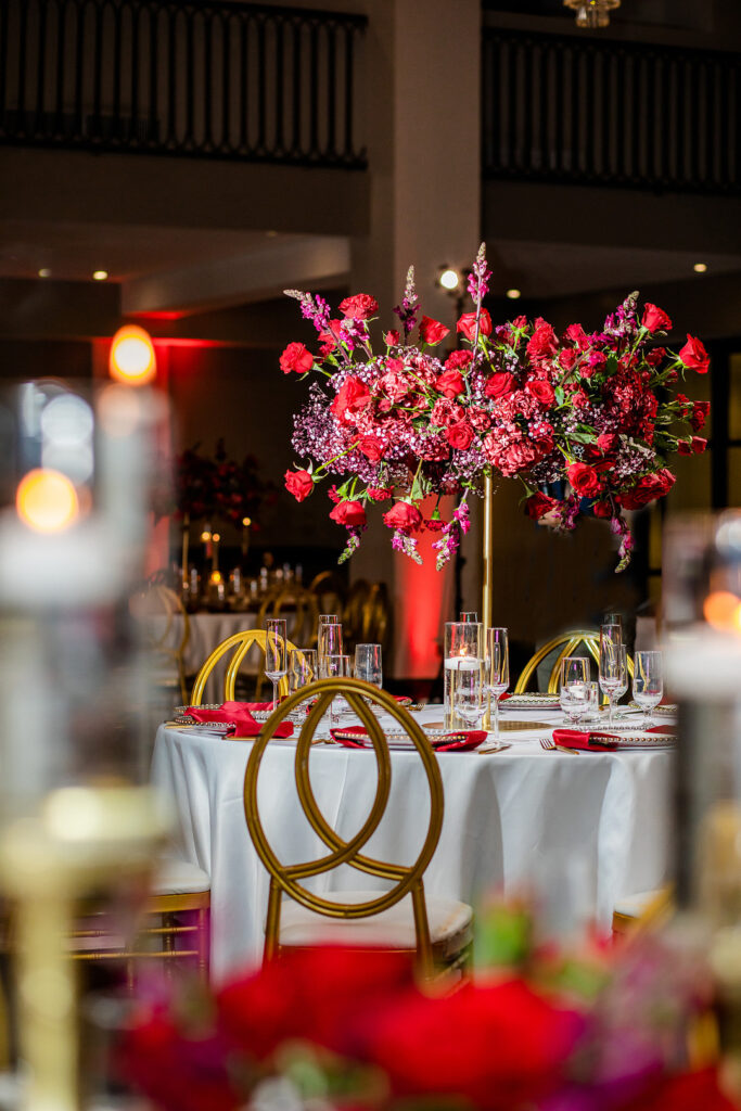 Jeremiah and Candace's luxe ballroom wedding in South Carolina featured oh-so-pretty red florals with an elegantly chic style.