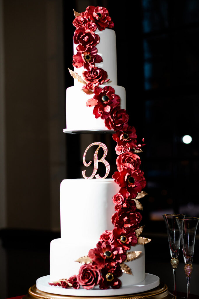 Jeremiah and Candace's luxe ballroom wedding in South Carolina featured oh-so-pretty red florals with an elegantly chic style.