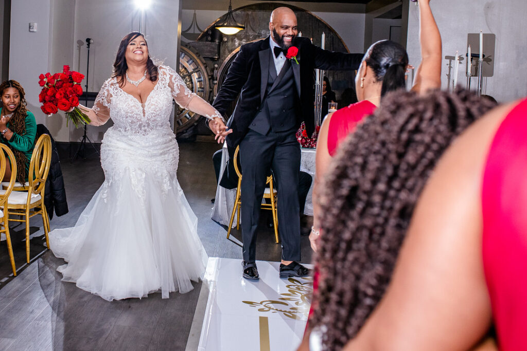 Jeremiah and Candace's luxe ballroom wedding in South Carolina featured oh-so-pretty red florals with an elegantly chic style.