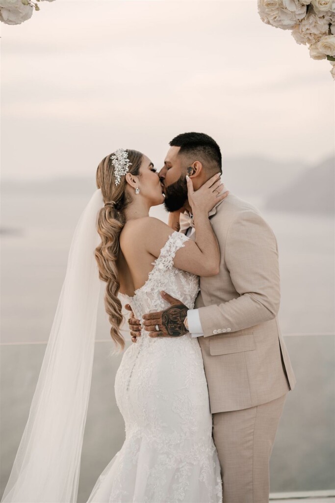 Featured in Issue 30, Jennifer and Zamir's modern & elegant elopement by the Sea in Santorini, Greece was everything they imagined and more.
