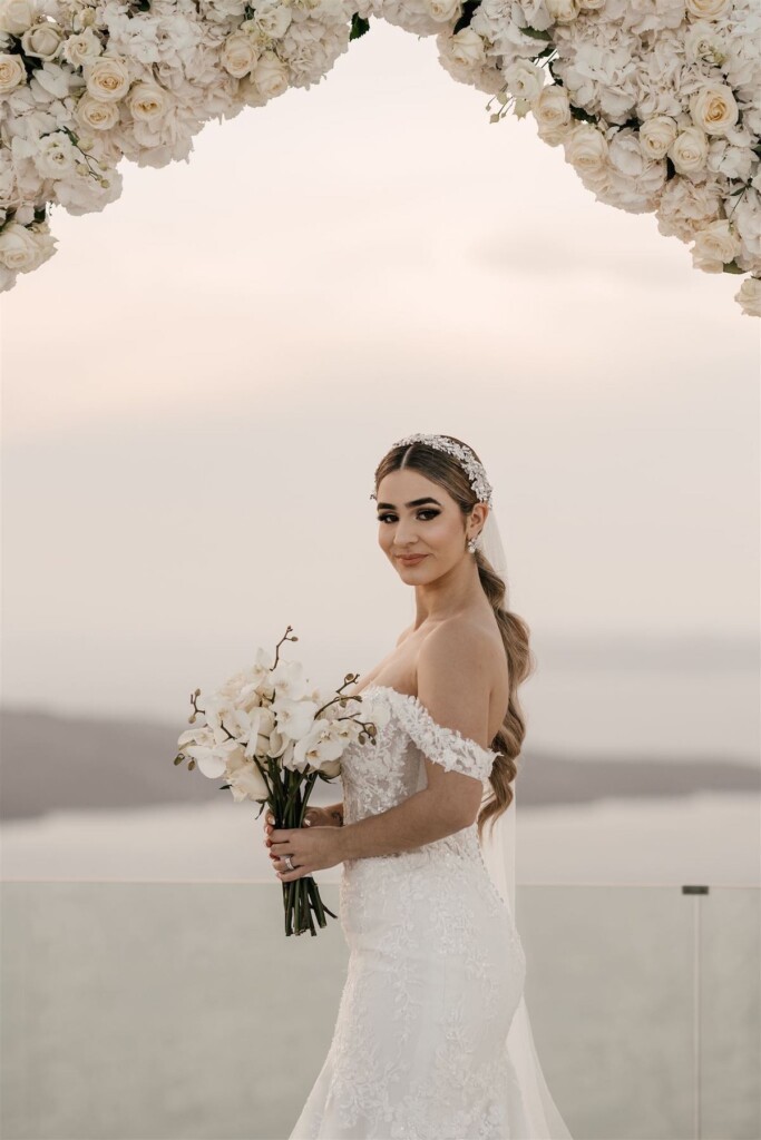 Featured in Issue 30, Jennifer and Zamir's modern & elegant elopement by the Sea in Santorini, Greece was everything they imagined and more.