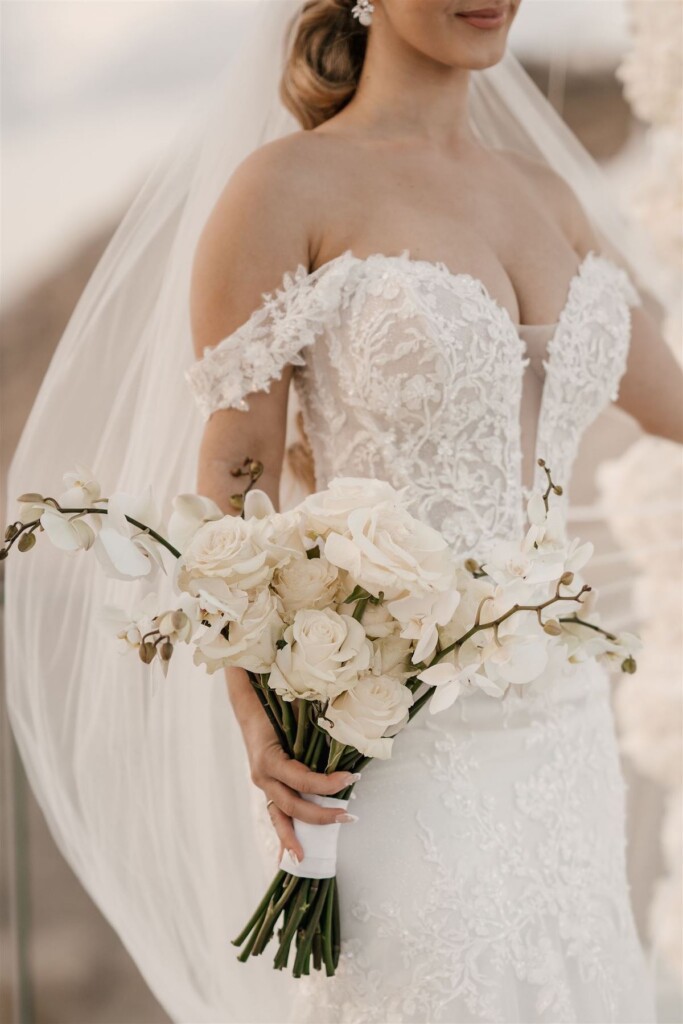 Featured in Issue 30, Jennifer and Zamir's modern & elegant elopement by the Sea in Santorini, Greece was everything they imagined and more.