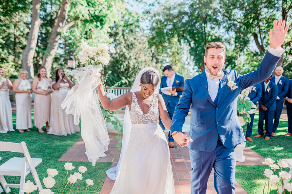 Brenda and Nolan's sunny outdoor estate wedding featured a cute something blue and a vintage phone booth built by the groom!