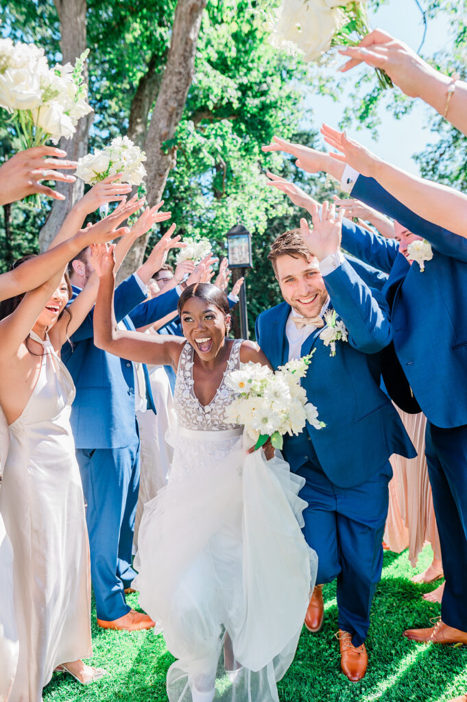 Brenda and Nolan's sunny outdoor estate wedding featured a cute something blue and a vintage phone booth built by the groom!