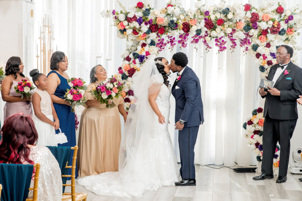 Vibrant jewel-toned colors and fun entertainment (including a caricaturist) made this ballroom wedding in South Carolina one of a kind.