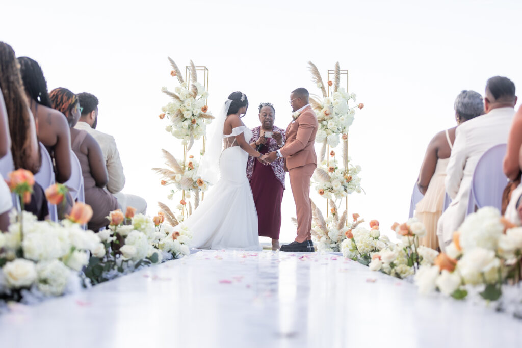 This travel-loving bride and groom exchanged their vows during a luxurious, romantic destination wedding in Jamaica overlooking Montego Bay.