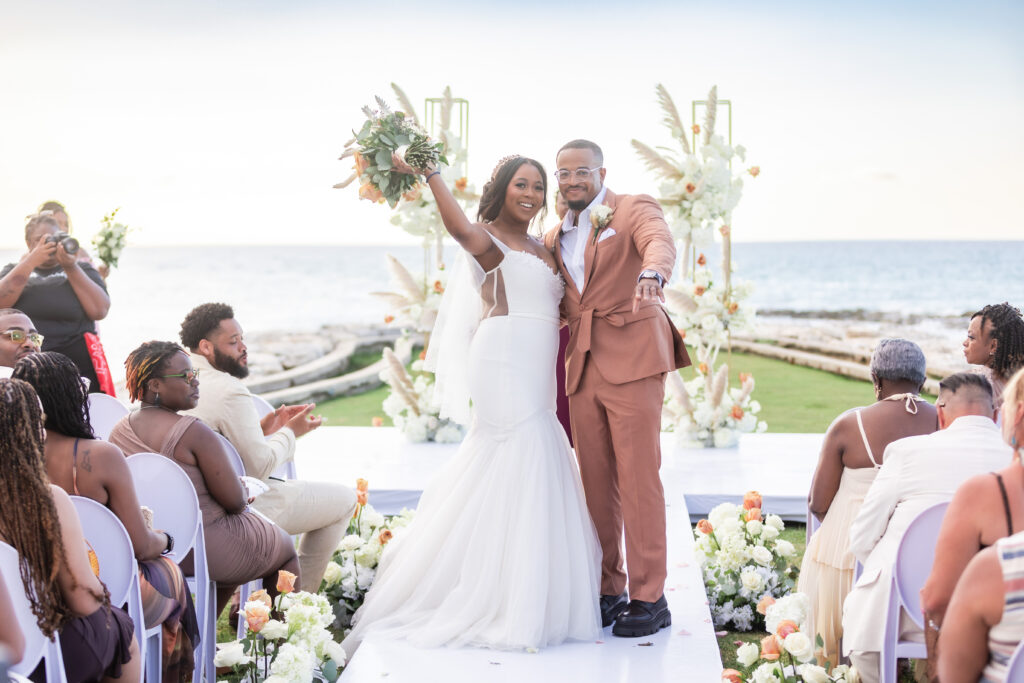 This travel-loving bride and groom exchanged their vows during a luxurious, romantic destination wedding in Jamaica overlooking Montego Bay.