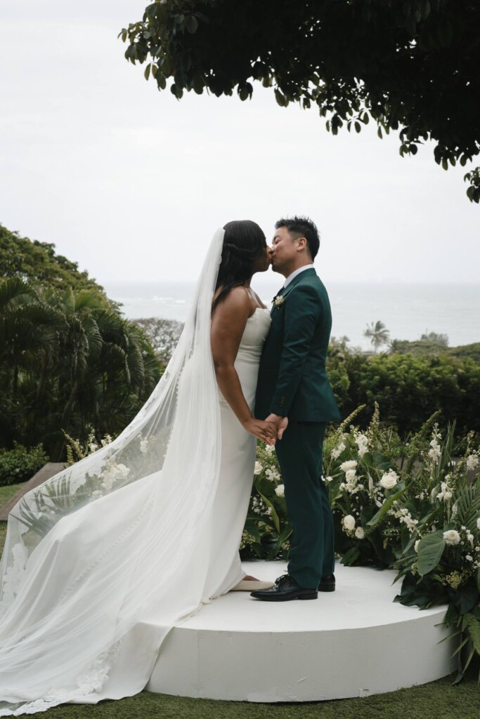 Oahu's soaring mountains and lush flora provided a breathtaking backdrop for Nicole and Ryo's chic garden wedding in Hawaii.