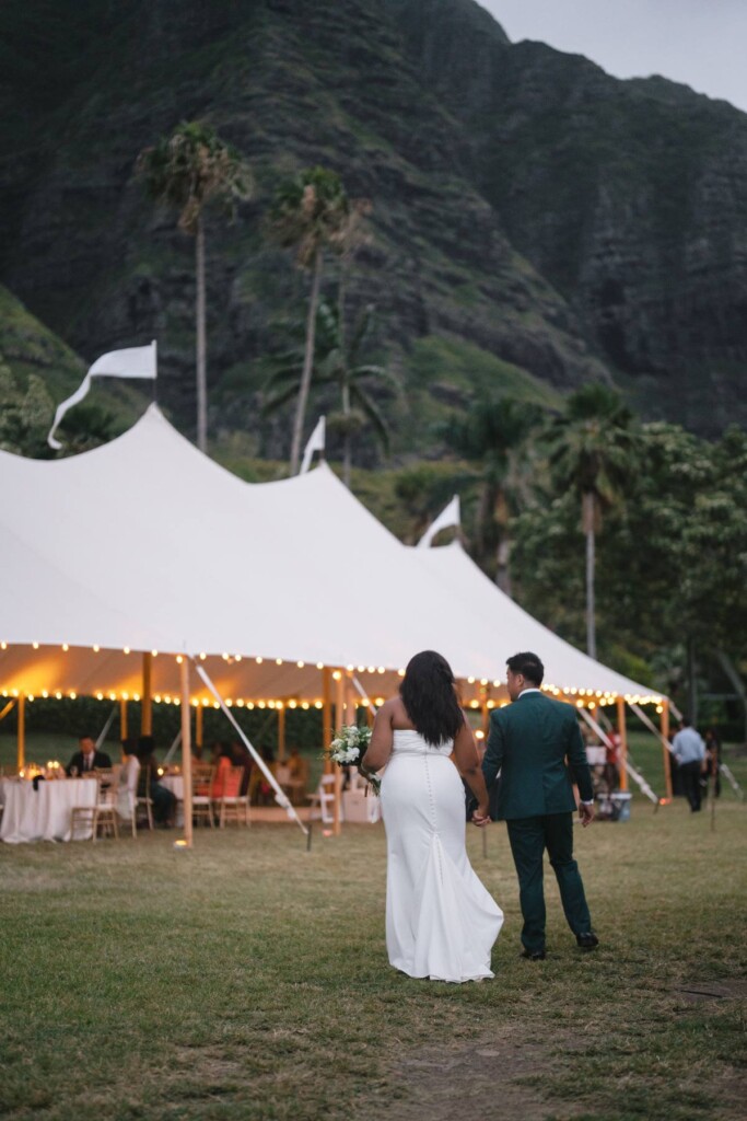 Oahu's soaring mountains and lush flora provided a breathtaking backdrop for Nicole and Ryo's chic garden wedding in Hawaii.