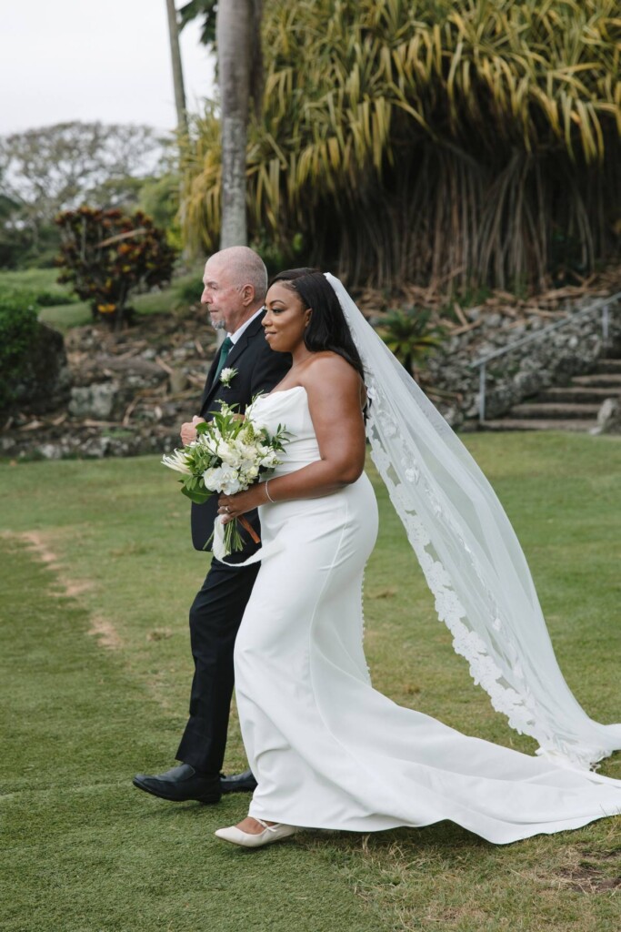 Oahu's soaring mountains and lush flora provided a breathtaking backdrop for Nicole and Ryo's chic garden wedding in Hawaii.