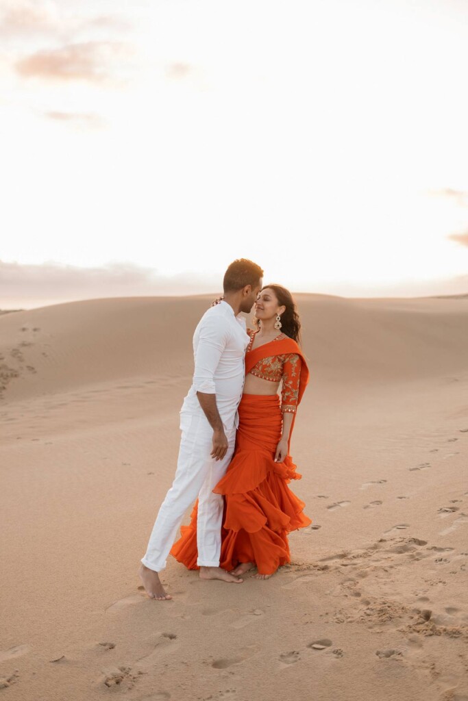 Nithin and Papiya celebrated their love with a dreamy Bollywood-inspired engagement session at the Oceano Dunes in California.