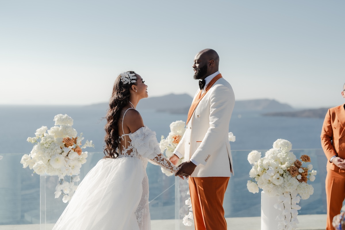 Finding Love Four Doors Down: Valerie & Kingsley’s Gorgeous Wedding in Santorini, Greece