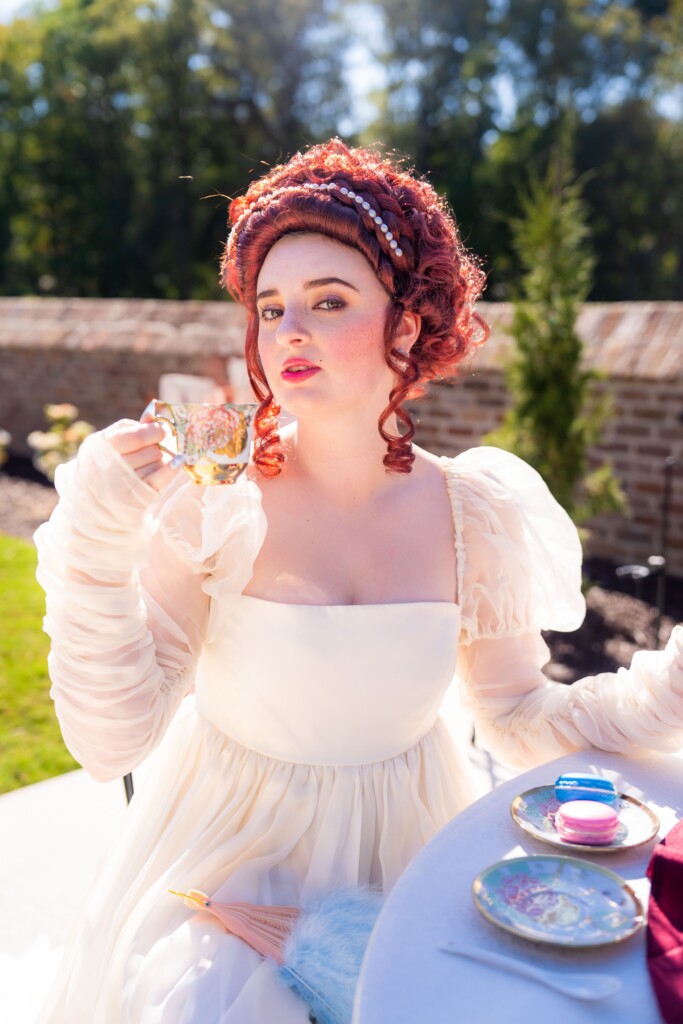 Muna Coterie gown designer and boutique owner Whitney Stephenson of Mahogany Brown Bridal invites you into a world of bridal elegance inspired by the regal grandeur of the Bridgerton era. 