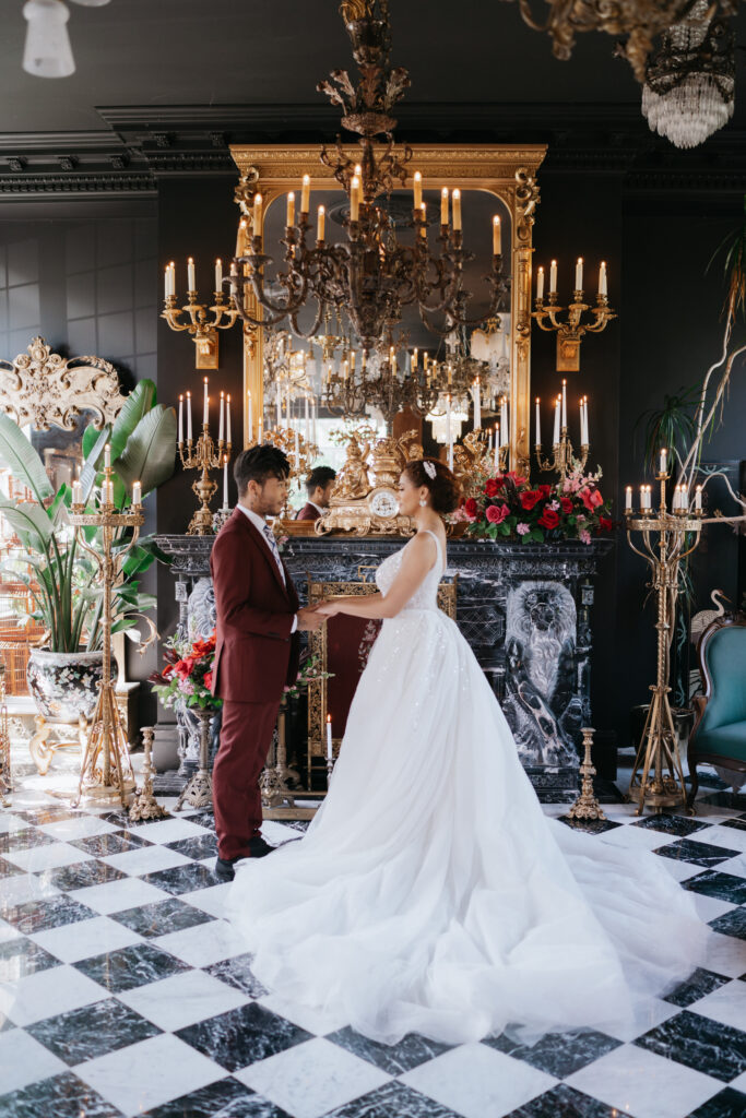 Victorian aesthetics, romantic decor, and deep-hued florals filled this luxurious wedding-styled shoot at Manoir Blackswan in Quebec.