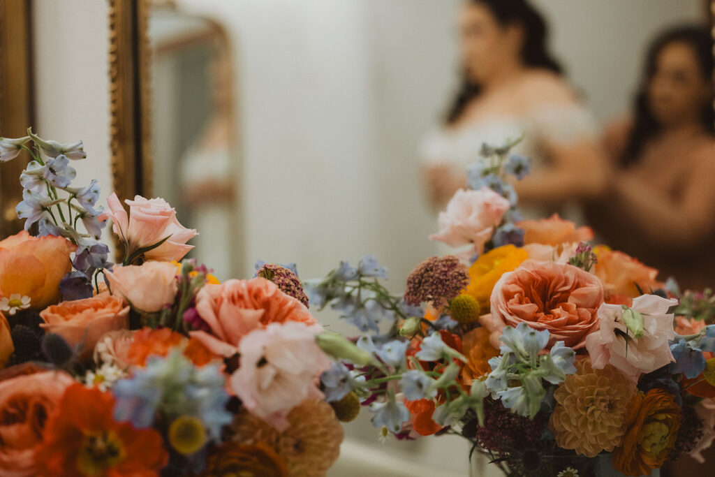 This charming rustic outdoor wedding was filled with vibrant summer florals and an unforgettable Morilee gown.