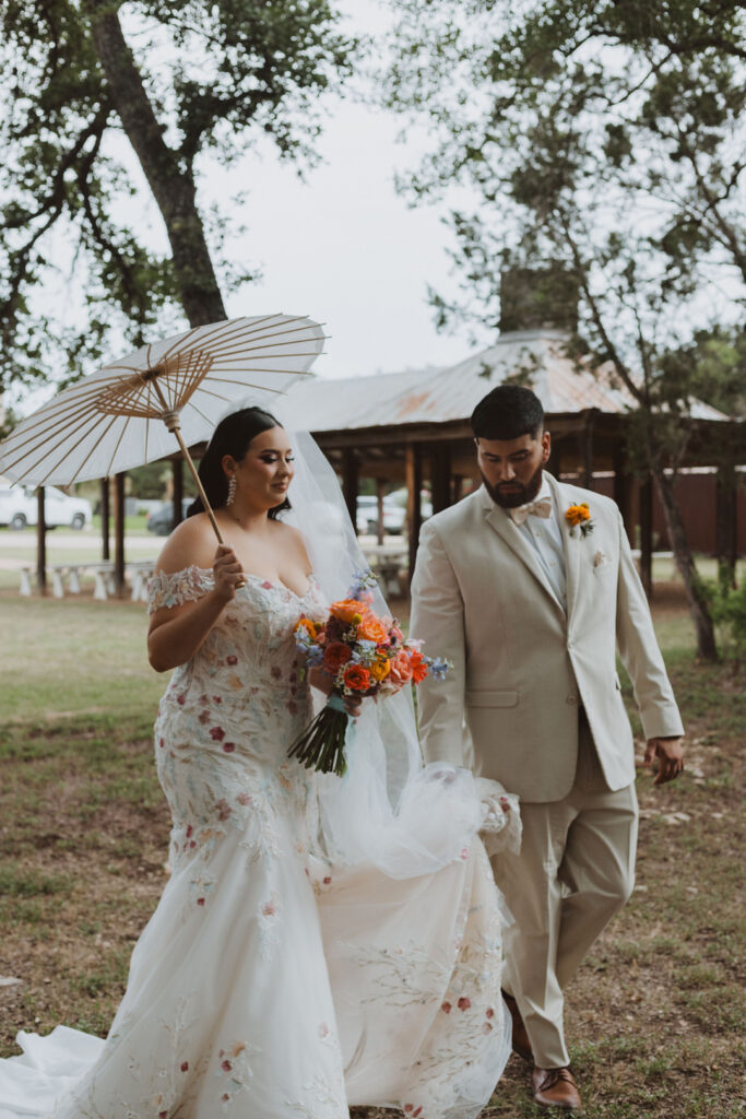 This charming rustic outdoor wedding was filled with vibrant summer florals and an unforgettable Morilee gown.