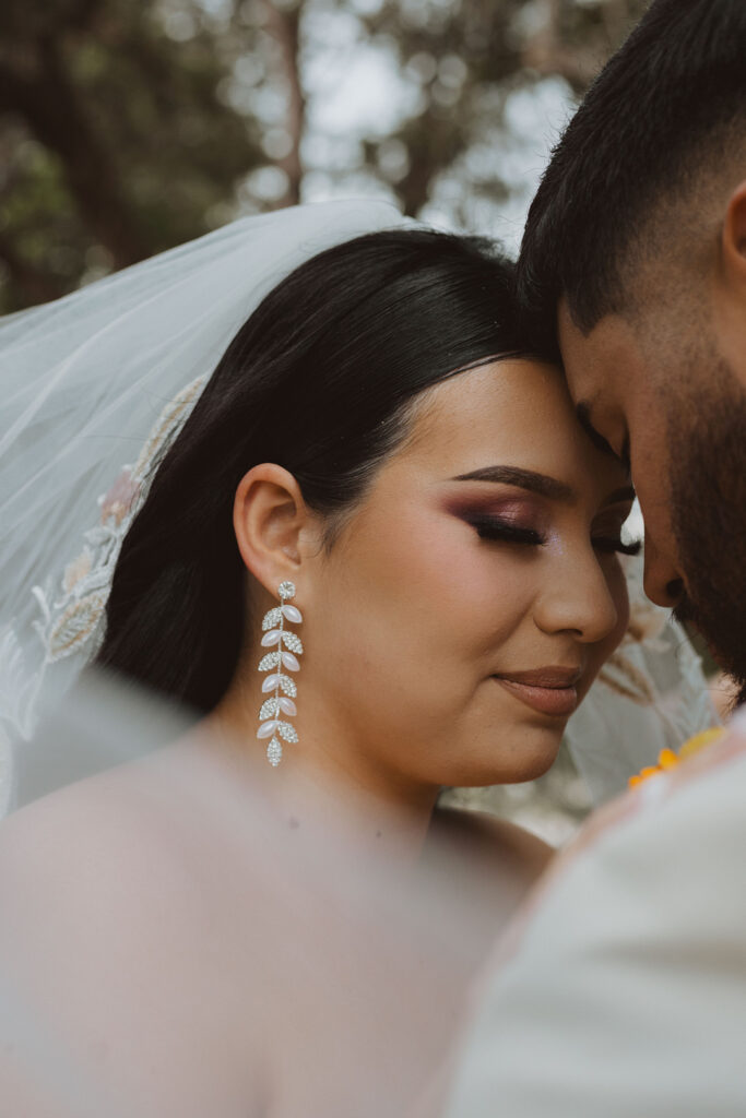 This charming rustic outdoor wedding was filled with vibrant summer florals and an unforgettable Morilee gown.