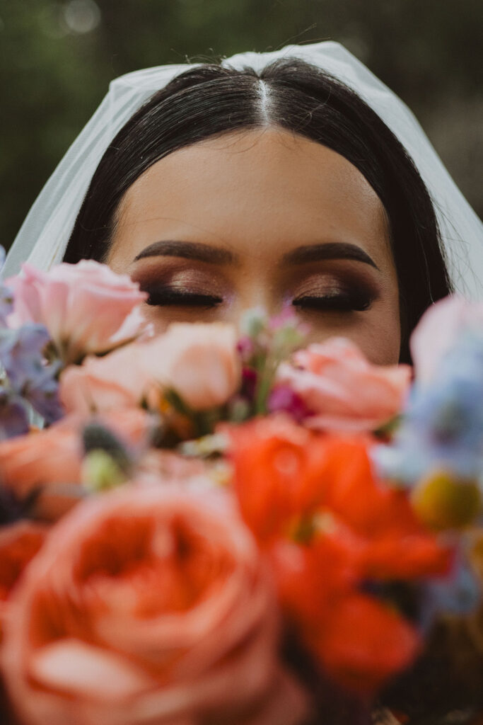 This charming rustic outdoor wedding was filled with vibrant summer florals and an unforgettable Morilee gown.