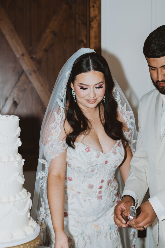 This charming rustic outdoor wedding was filled with vibrant summer florals and an unforgettable Morilee gown.